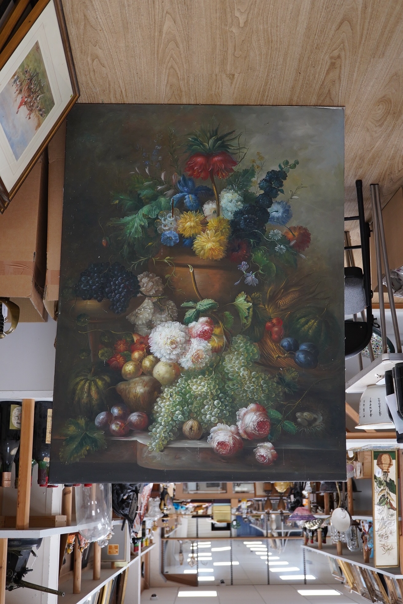 20th century, Dutch style, set of three oils on canvas, Still life scenes of flowers and fruit, unsigned, each 92 x 121cm, unframed. Condition - fair